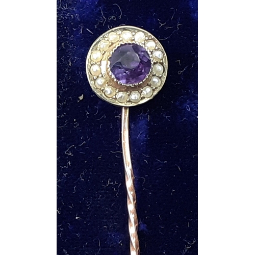 8 - A beautiful cased 9ct gold stick pin, with amethyst centre stone surrounded by seed pearls, in lovel... 