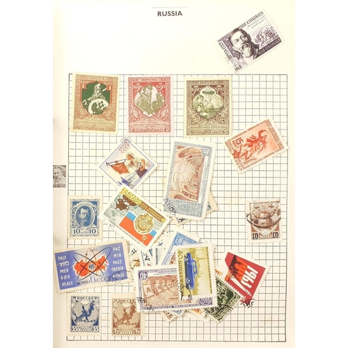 180 - A collection of 4 stamp albums containing a mix of world stamps, hinged, mainly early to mid 20th ce... 