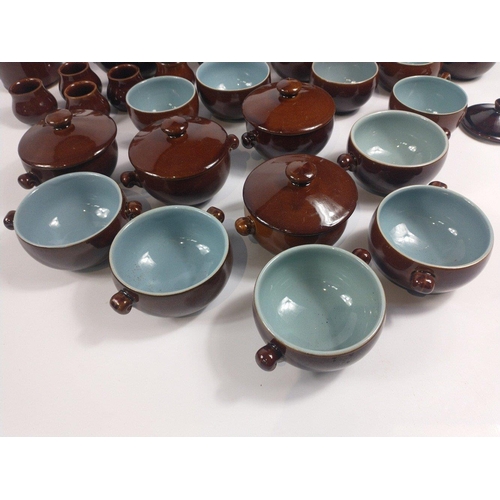 284 - A retro DENBY part set in a highly glazed brown finish with blue inners to include a super size teap... 