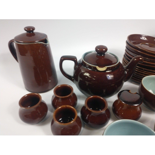 284 - A retro DENBY part set in a highly glazed brown finish with blue inners to include a super size teap... 