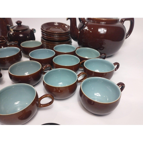 284 - A retro DENBY part set in a highly glazed brown finish with blue inners to include a super size teap... 