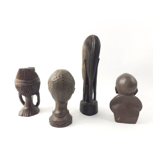 304 - A super little lot of 3 carved African hardwood heads, largest standing 23 cm.  Also a pottery signe... 