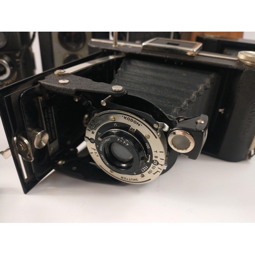 329 - A wonderful vintage photography lot to include a Super Six-20 Kodak Eastman folding camera with love... 