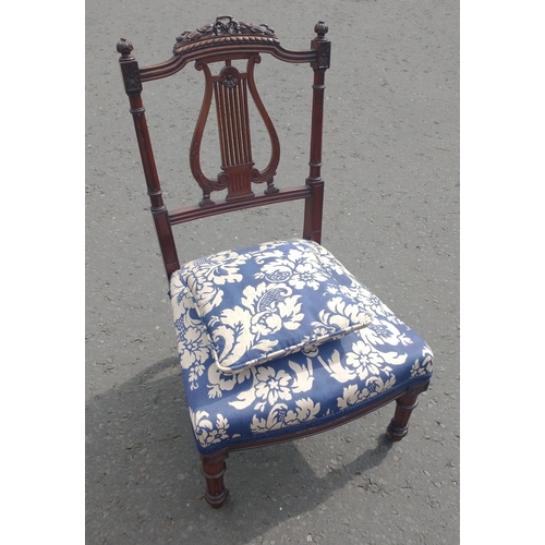 389 - A LYRE-backed child's chair with original ceramic wheels. This chair has been recently lovingly reco... 