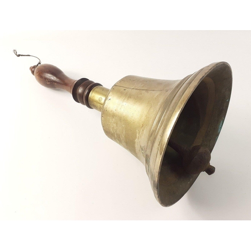 154 - An impressive hand bell with wooden handle, with an equally impressive ring sound.  Height 42cm#24... 