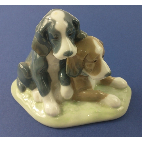 203 - A NAO 545 puppies group 11cm high, length 15.5cm approx#37