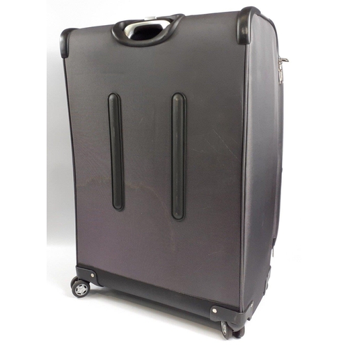 314 - A large IT suitcase 80cm tall including castors#74