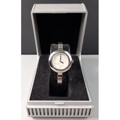 106 - A GUCCI ladies 105 diamond bangle watch (11258761) in presentation box#106