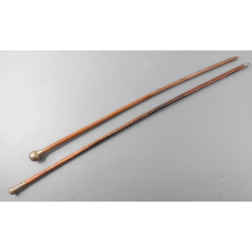 125 - Two interesting officers' swagger sticks, one stamped EPSOM (70cm long), the other with wear and a b... 