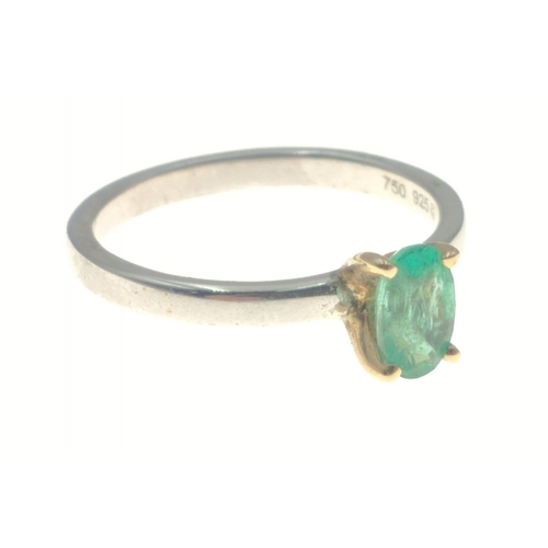 13 - A 925 shank ring with 18K gold claws holding a solitaire green stone, size K, gross weight 1.6g appr... 