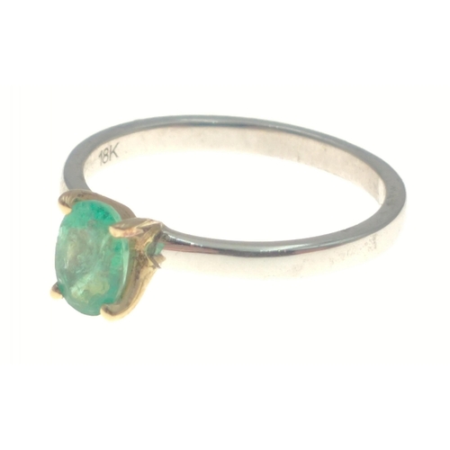13 - A 925 shank ring with 18K gold claws holding a solitaire green stone, size K, gross weight 1.6g appr... 