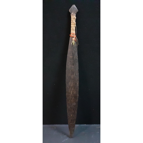 131 - A decorative Indian wooden paddle, 124cm long approx.#131