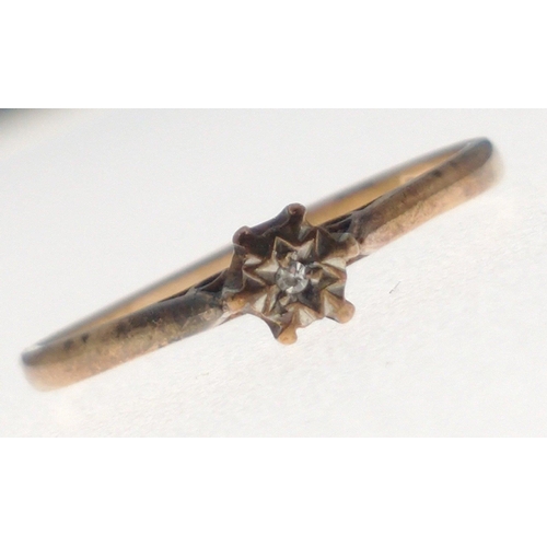 2 - A gold hallmarked 9ct ring with a small centre diamond set in a star shaped mount. Total gross weigh... 