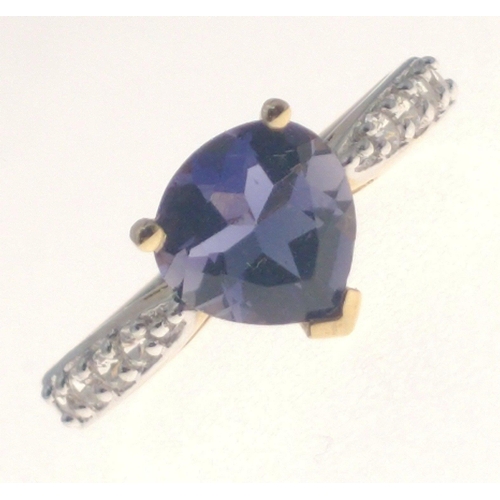 20 - A Jaipur India TGGC 10K Jaipur ring, with diamond shoulders and a central pear shaped tanzanite ston... 