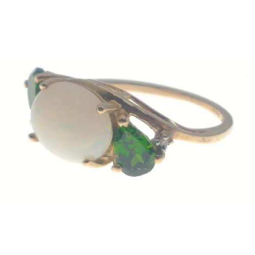 22 - A TGGC 9K hallmarked ring with an oval opal centre stone (10mm approx) and 2 teardrop shaped emerald... 