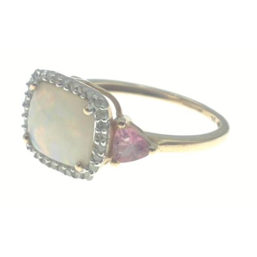 26 - A 9ct opal (10mm approx) ring surrounded by diamond chips and 2 trillion cut pink stones on the shou... 
