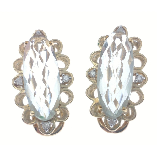 31 - A pair of 375 hallmarked large earrings with approx 20mm centre stones and diamond chips to side, gr... 