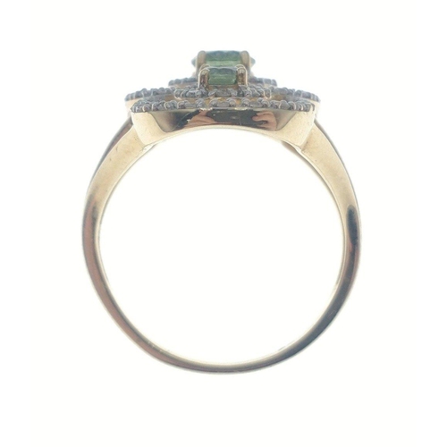 36 - A stunning 585 stamped gold ring set with 3 peridots and circlets of small diamonds (30mm long), siz... 