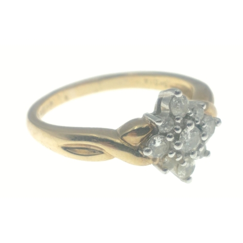 46 - A BEAUTIFUL ring comprising eight diamonds surrounding a larger diamond (3mm approx), all tested, st... 