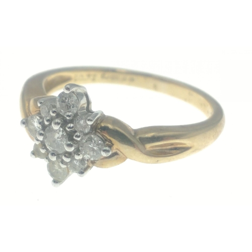 46 - A BEAUTIFUL ring comprising eight diamonds surrounding a larger diamond (3mm approx), all tested, st... 