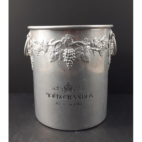 58 - Champers all round - an aluminium MOET & CHANDON ice bucket with repousse design of grapes and v... 