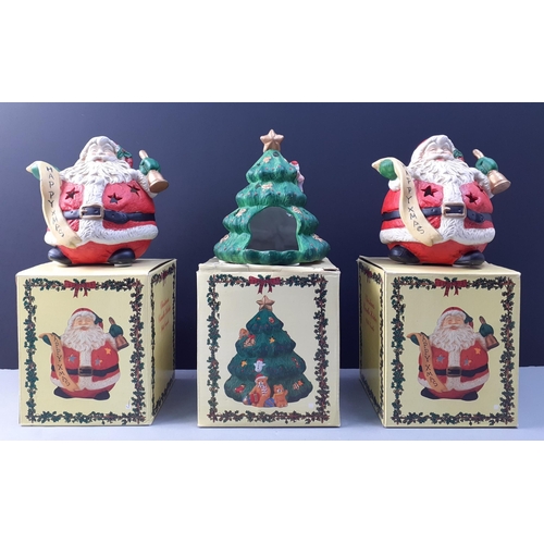 664 - Three boxed Christmas candle holders - two Santas and one Christmas tree each 13cm approx#669