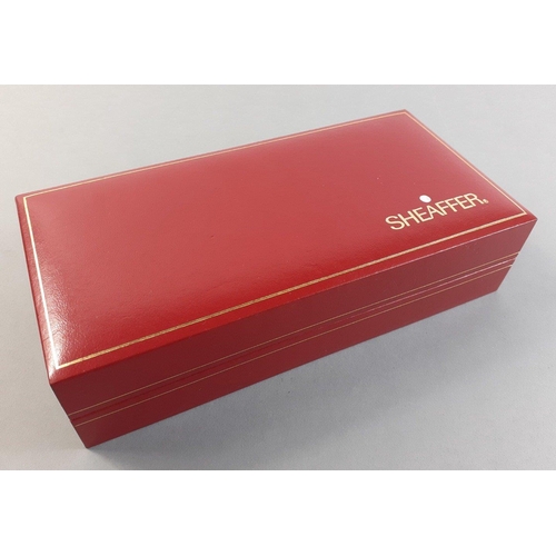 104D - Set of 2 SHEAFFER pens in red SHEAFFER presentation box. Both in chrome finishes with gold electropl... 