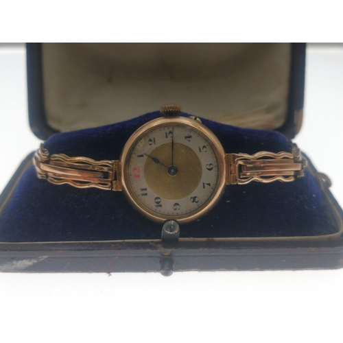 18 - An ANTIQUE 375 stamped yellow gold watch case with a 9ct stamped yellow gold bracelet gross weight 2... 