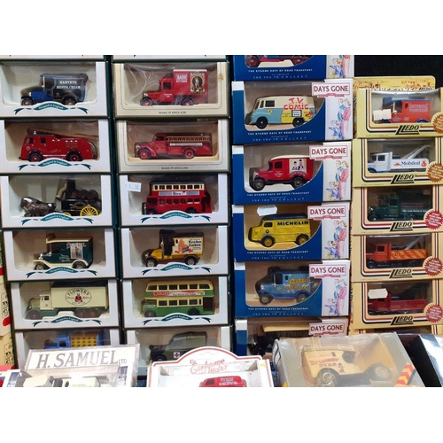 182 - A large box of collectible boxed model cars to include Boots Vintage Collection model van, a Pepsi-C... 