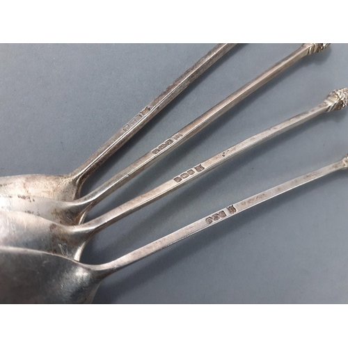 29 - Four silver hallmarked spoons with pine cone finials, all Sheffield, 3 marked 1920, the other 1923, ... 