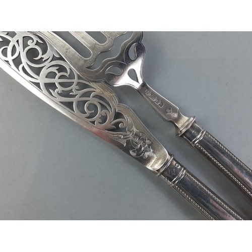 36 - A fully hallmarked cake slice and fork with filled handles, Sheffield 1880, made by Richard Martin &... 