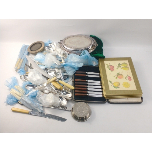 46 - A useful EPNS lot to include a nice serving tray, coasters, a cased set of butter knives and much fl... 