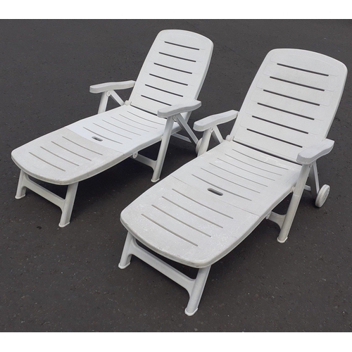 491 - Two ROBUST white plastic garden recliners in good order.#515