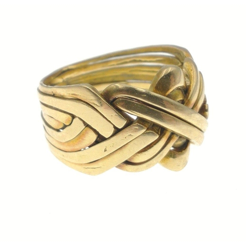 5B - A SUBSTANTIAL yellow metal ring stamped 18 in Arabic independent jewellers tested as 18-22ct, made t... 