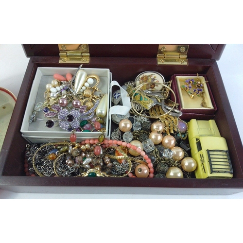 84 - A jewellery box containing a lovely assortment of pretty costume jewellery to include brooches, bang... 