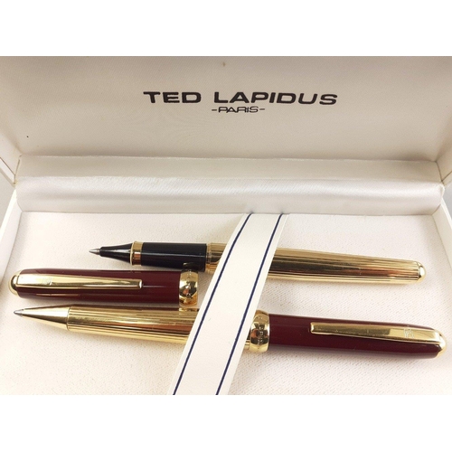 104C - Two TED LAPIDUS of Paris ballpoint pens in TED LAPIDUS white presentation case. Both in similar desi... 