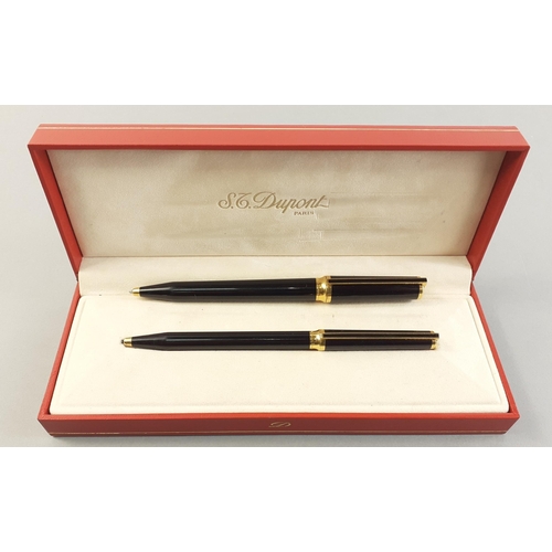 104B - Two St Dupont 'Laque de chine' ballpoint pens in a St Dupont of Paris red presentation box. Thinner ... 