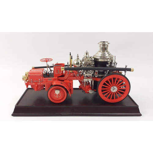 141 - A Franklin Mint 1912 CHRISTIE FRONT DRIVE STEAMER with plinth, certificate and paperwork. Some loose... 