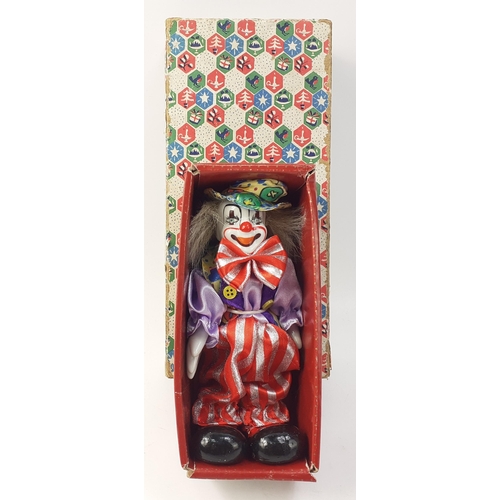 240 - A ceramic faced boxed clown, 15cm approx#56