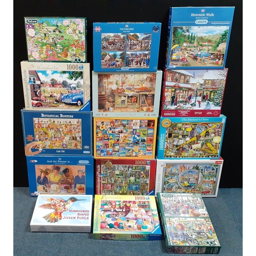 243 - Sixteen jigsaw puzzles in good condition with a variety of pictures including 'And the Winner Is.. '... 