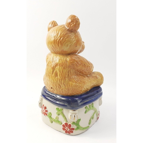 311 - A charming ceramic teddy bear sitting on a stool.  Stands 24cm high approx with no damage#85