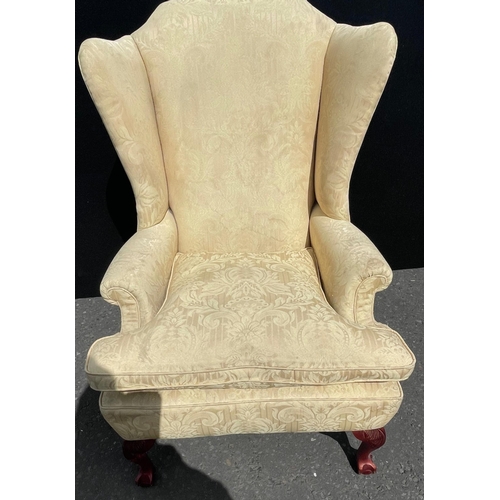 471 - A large WINGED armchair in soft LUXURIOUS yellow fabric supported on ball and claw feet#159