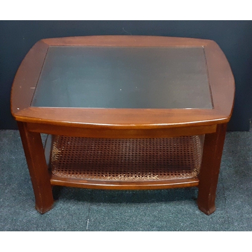 473 - A small glass top coffee table with rattan base. In good condition. 
 W72xD55xH43cm approx#161