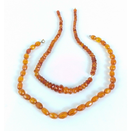 86 - A graduated amber beaded necklace with screw fitting 43cm long approx, weighs 16g approx and one oth... 