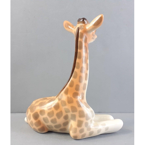 218 - A vintage LOMONOSOV made in Russia seated ceramic giraffe 14cm high approx#58