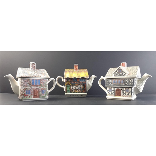 268 - Three character ENGLISH COUNTRY HOUSES teapots to include 17th century Cottage, The Old Forge, and T... 