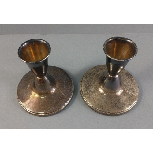 48 - A pair of silver hallmarked, Birmingham 1960, candle sticks with weighted bases.  Gross weight 160g ... 