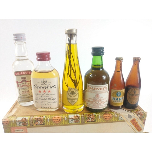 117 - A Churchill cigar box with contents of miniatures to include The Royal Mile, Black Bottle, Glenfiddi... 