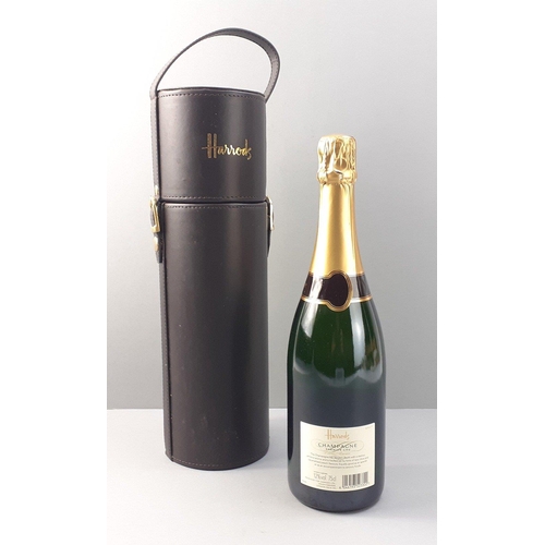 220 - A bottle of HARRODS Champagne with a leather look bottle carrier#240