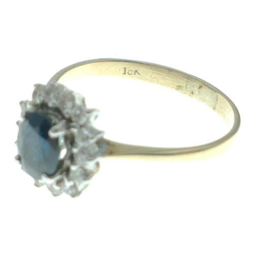 10 - A 18ct diamond and sapphire ring. Size M, gross weight 2.19g approx.  A lovely piece that displays b... 